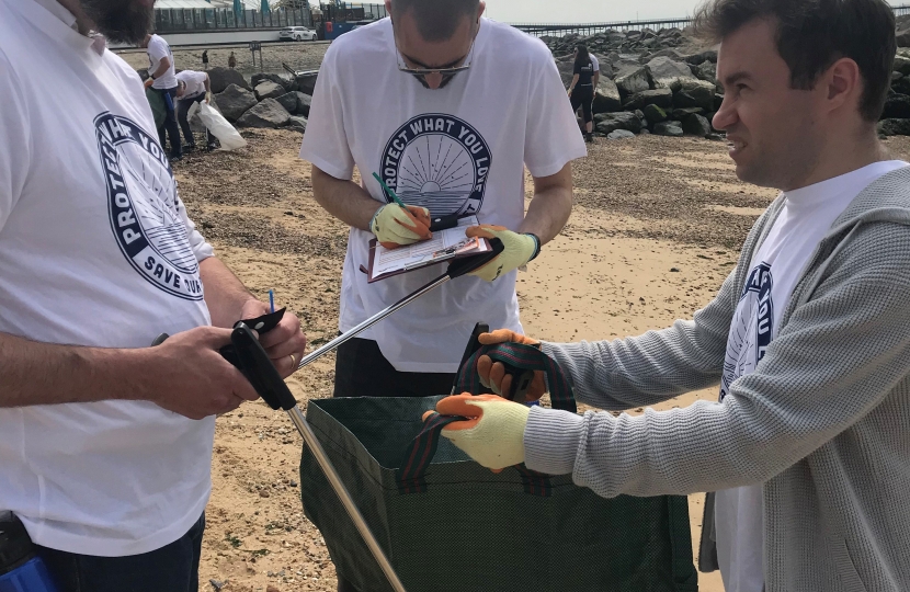 James picking up litter on the beach