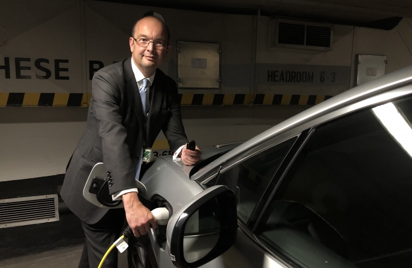 James Duddridge charging the electric car inside Parliament 