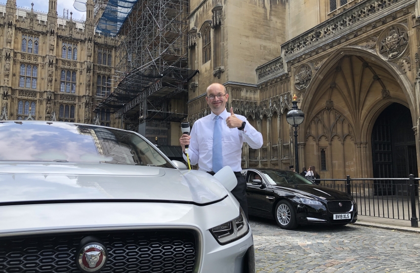 James Duddridge with the electric car outside Parliament 