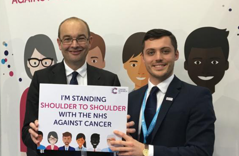 James Duddridge with a Cancer Research UK rep