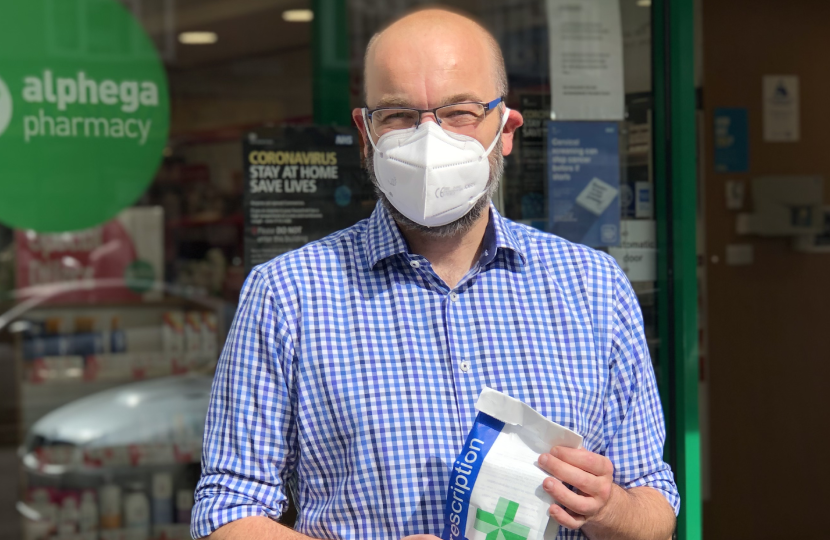 James outside a pharmacy 