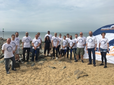 James out with the beach cleaning team